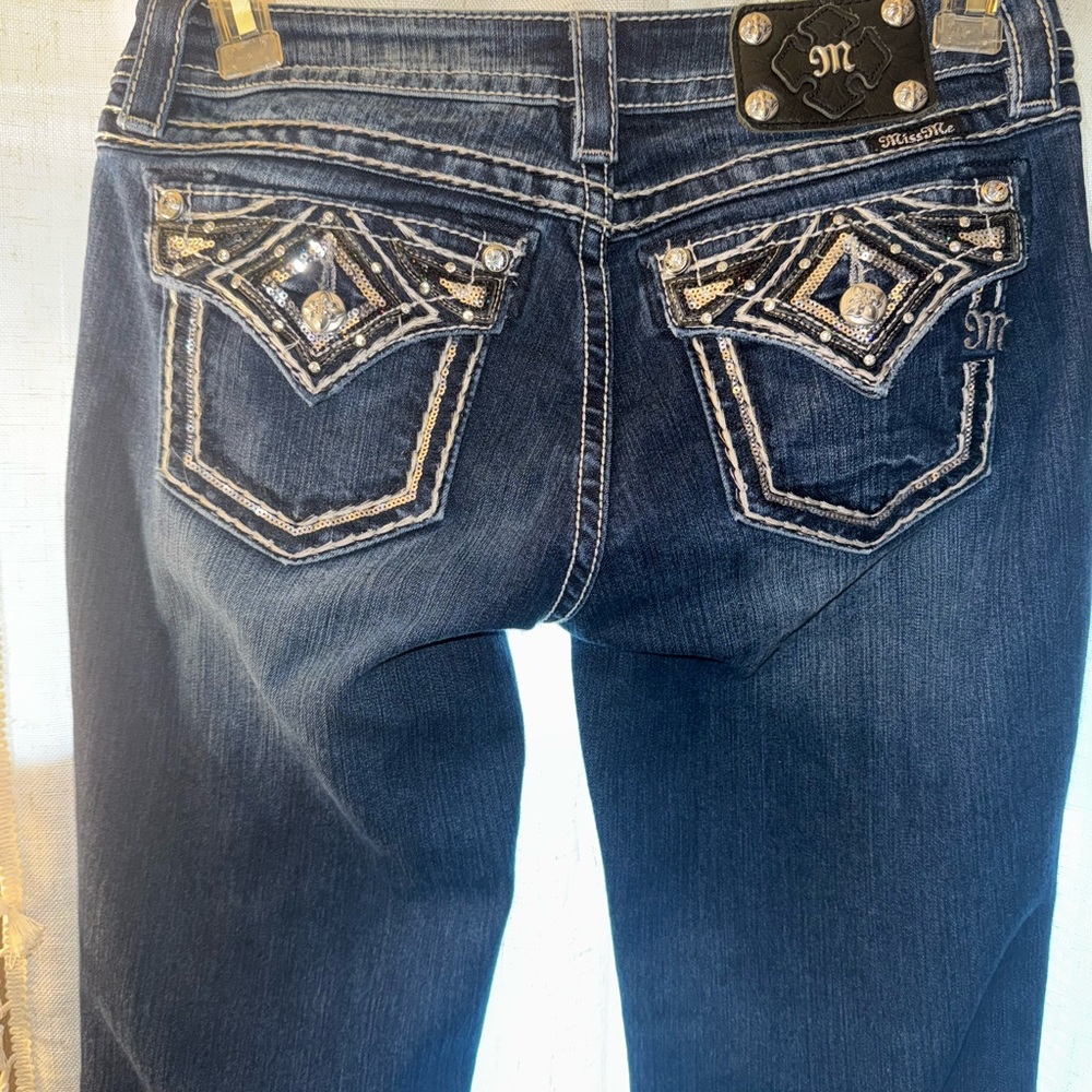 Dark blue with light stitching. Miss Me Blue Boot Cut Jeans. Size 30 Long
